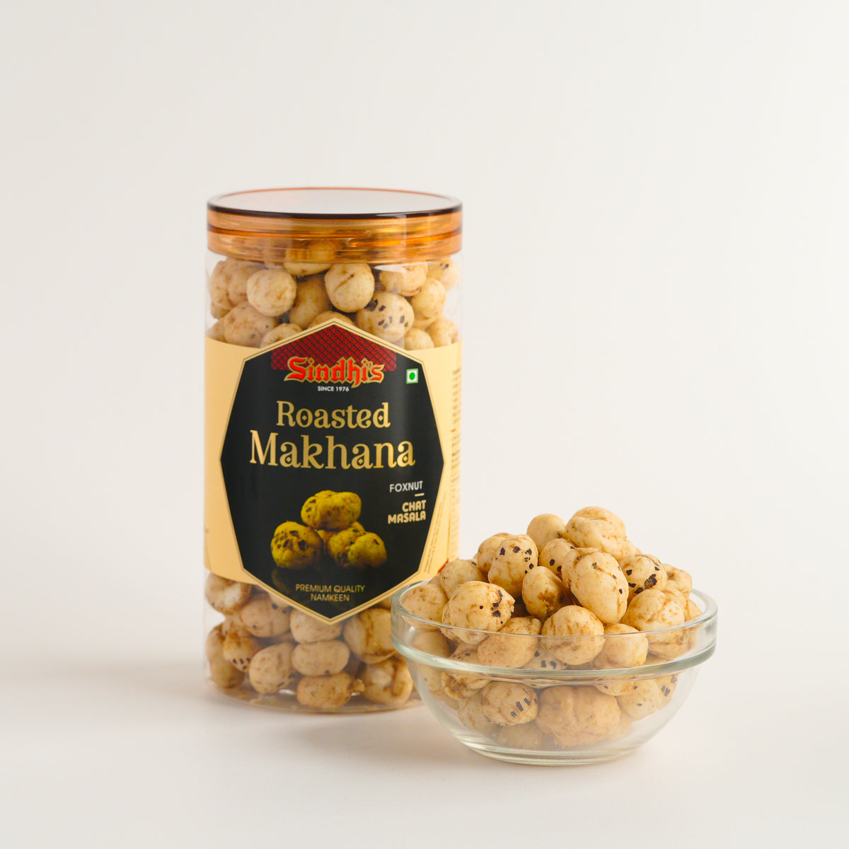 Jar and bowl of roasted makhana with Sindhi's label on a white background