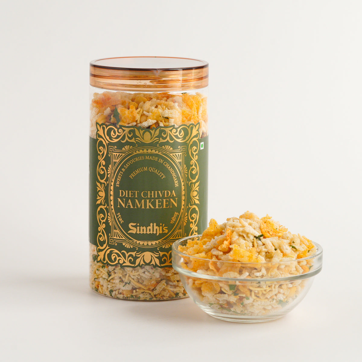 Jar of Diet Chivda Namkeen with a bowl of snacks on a white background