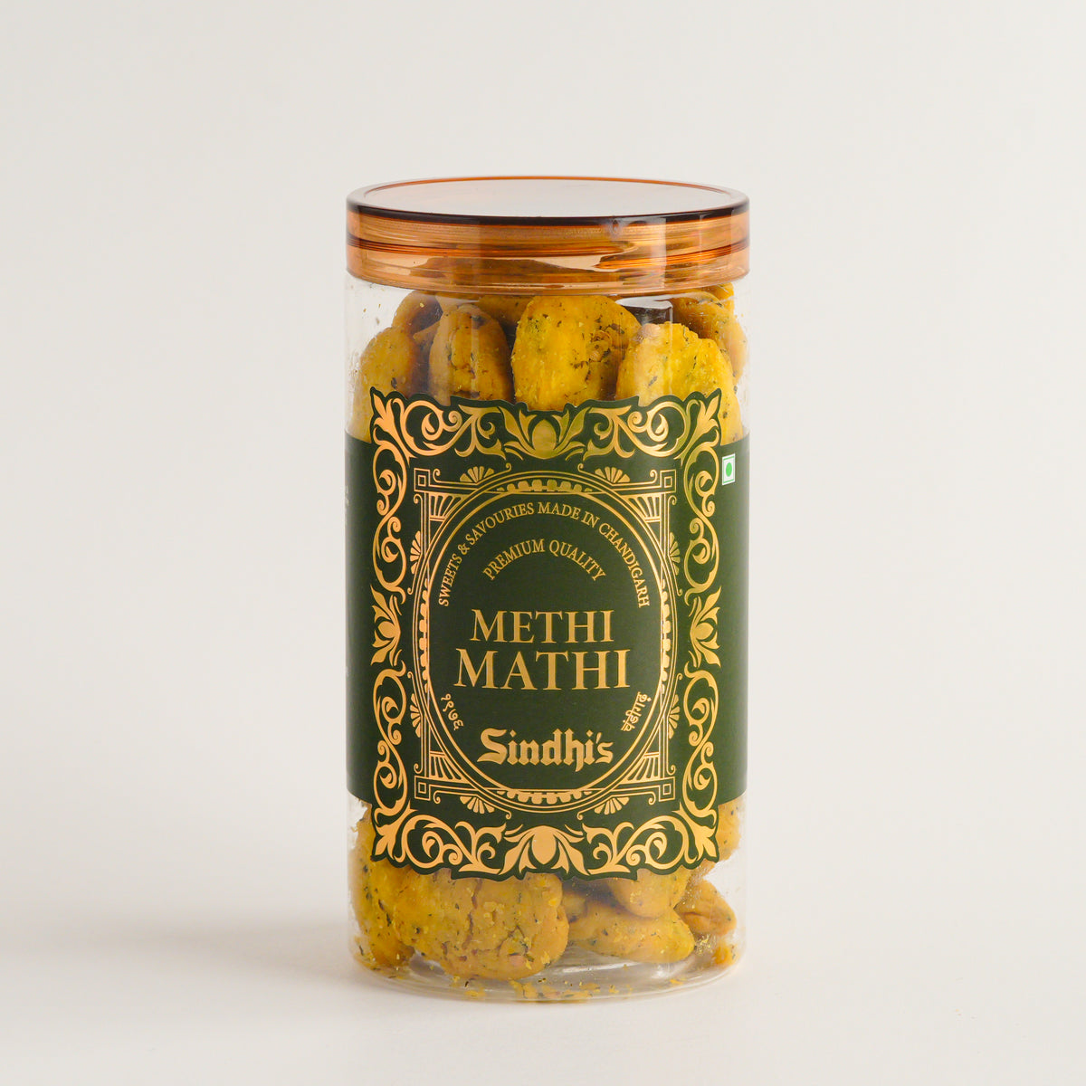 Jar of 'Methi Mathi' with decorative label on a white background