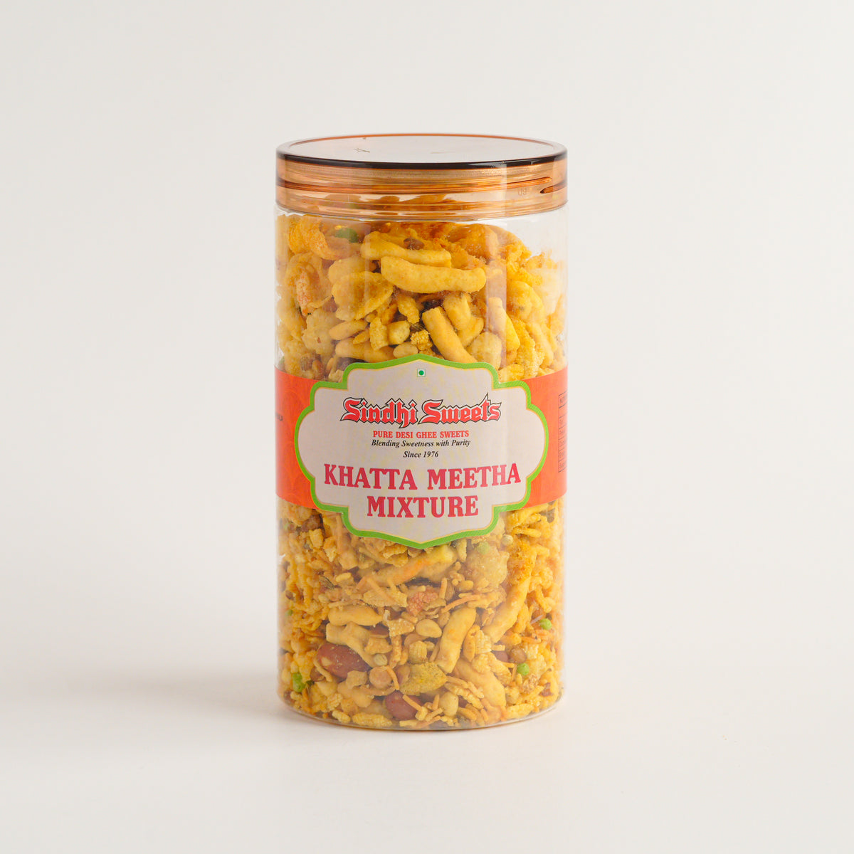 Jar of Sushmi Sweets Khatta Meetha Mixture on a light gray background