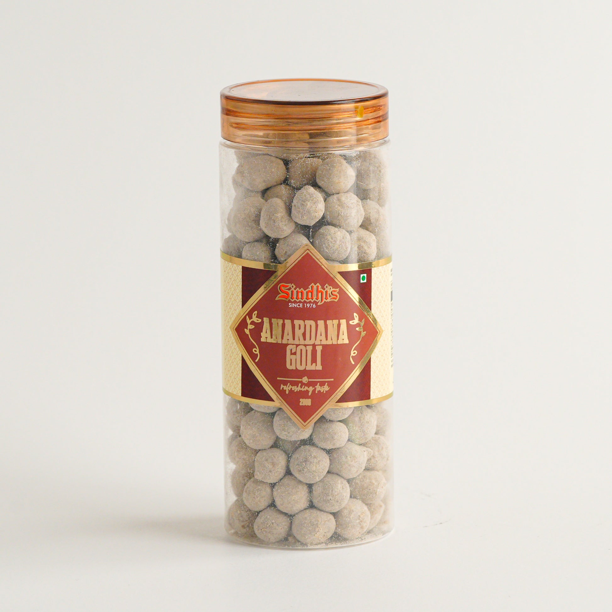 Tall cylindrical container with a gold lid and label featuring text and graphics on a white background