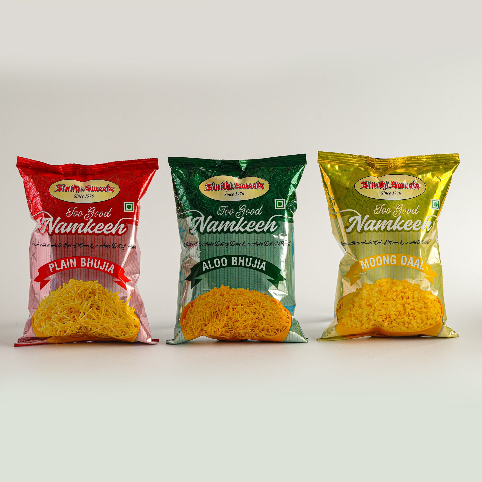 Three packages of Sindhi Sweets Namkeen on a white background
