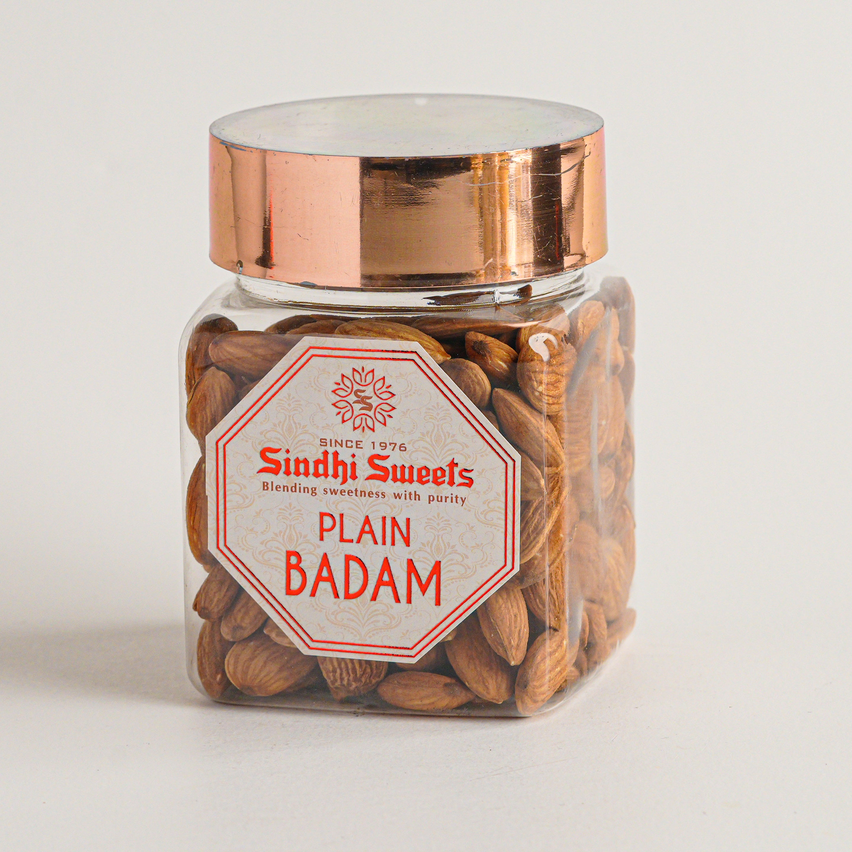 Jar of Sindhi Sweets Plain Badam on a light gray background