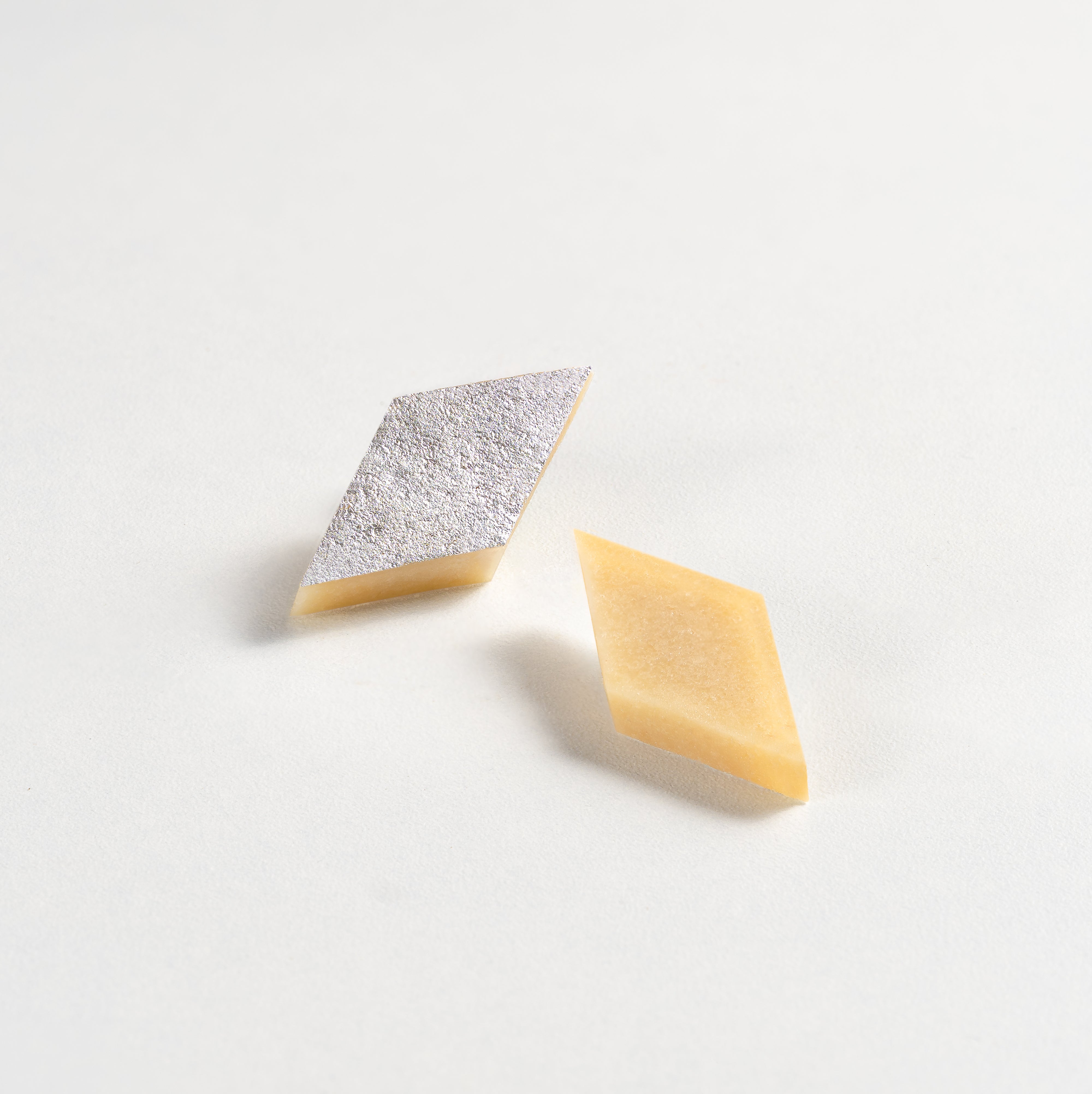Two geometric-shaped cookies on a light gray background