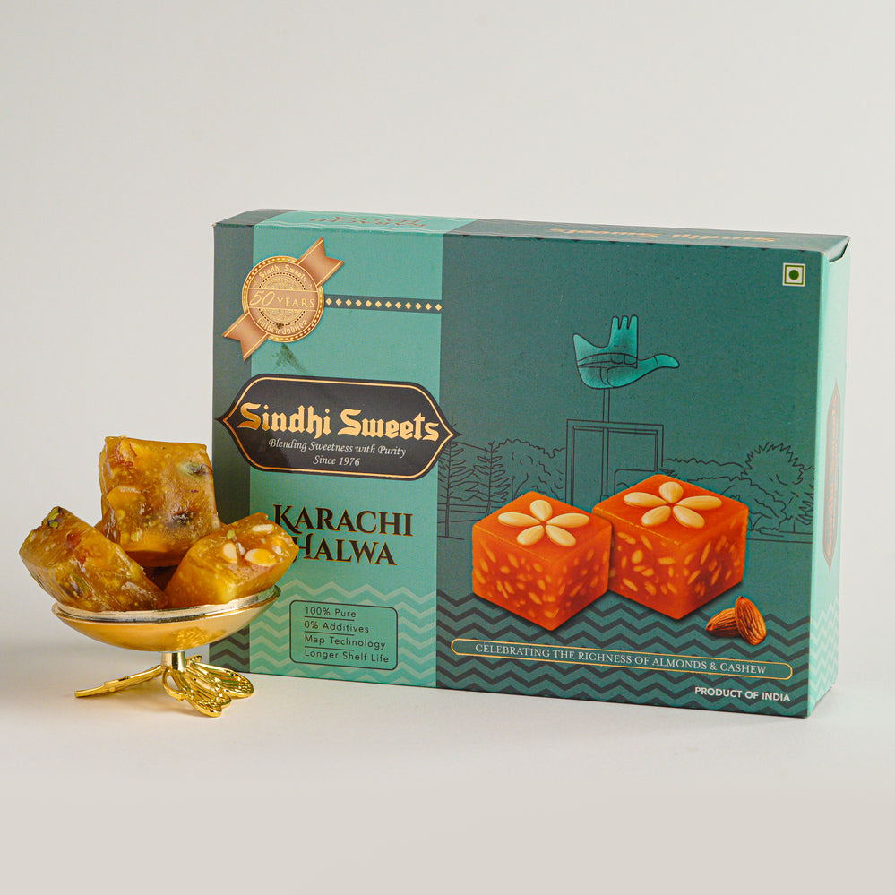 Box of Karachi Halwa with pieces of halwa on a white background