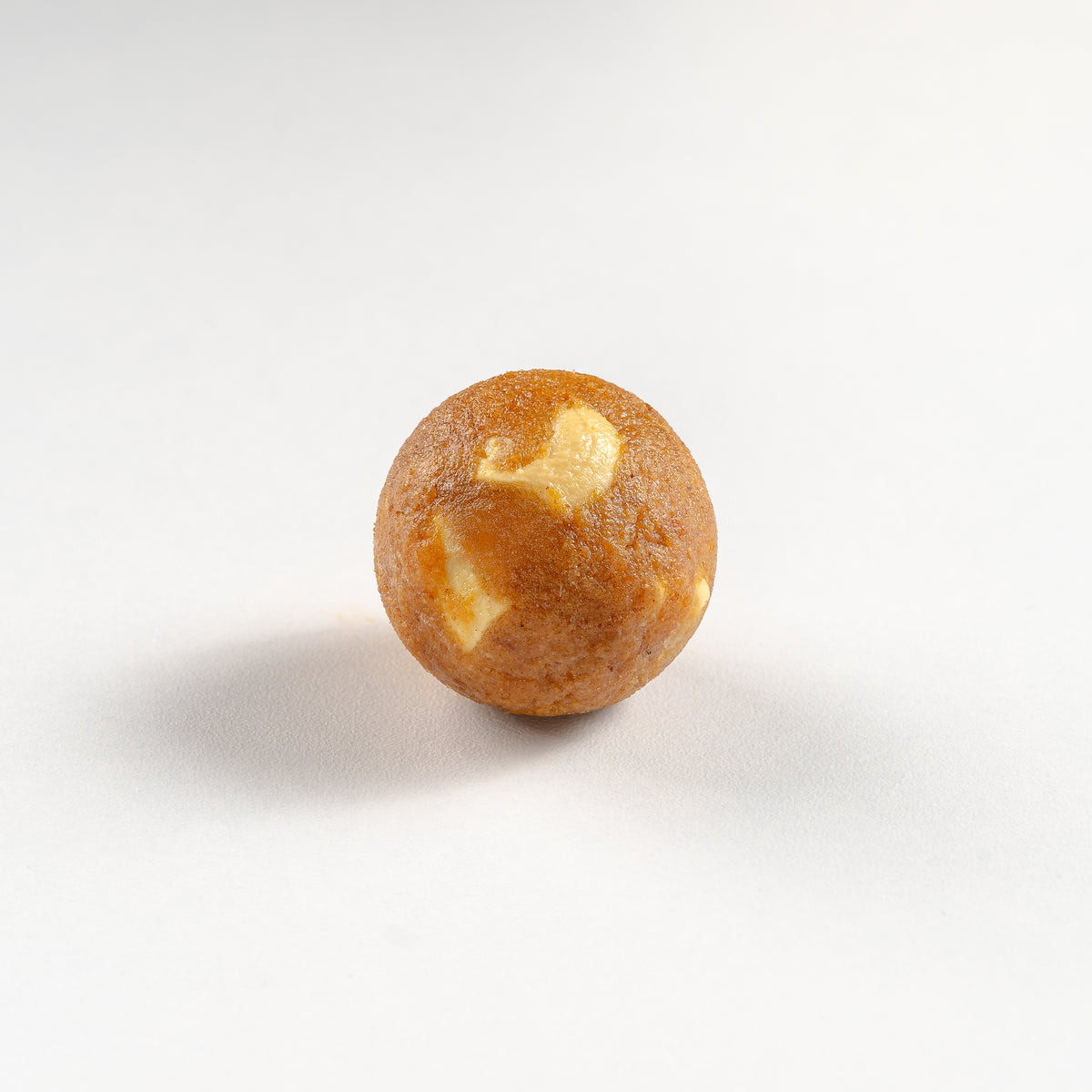 Round cookie with white filling on a white background