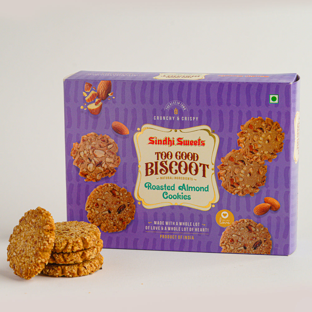 Box of Sindhi Sweets Roasted Almond Cookies with cookies in front on a white background